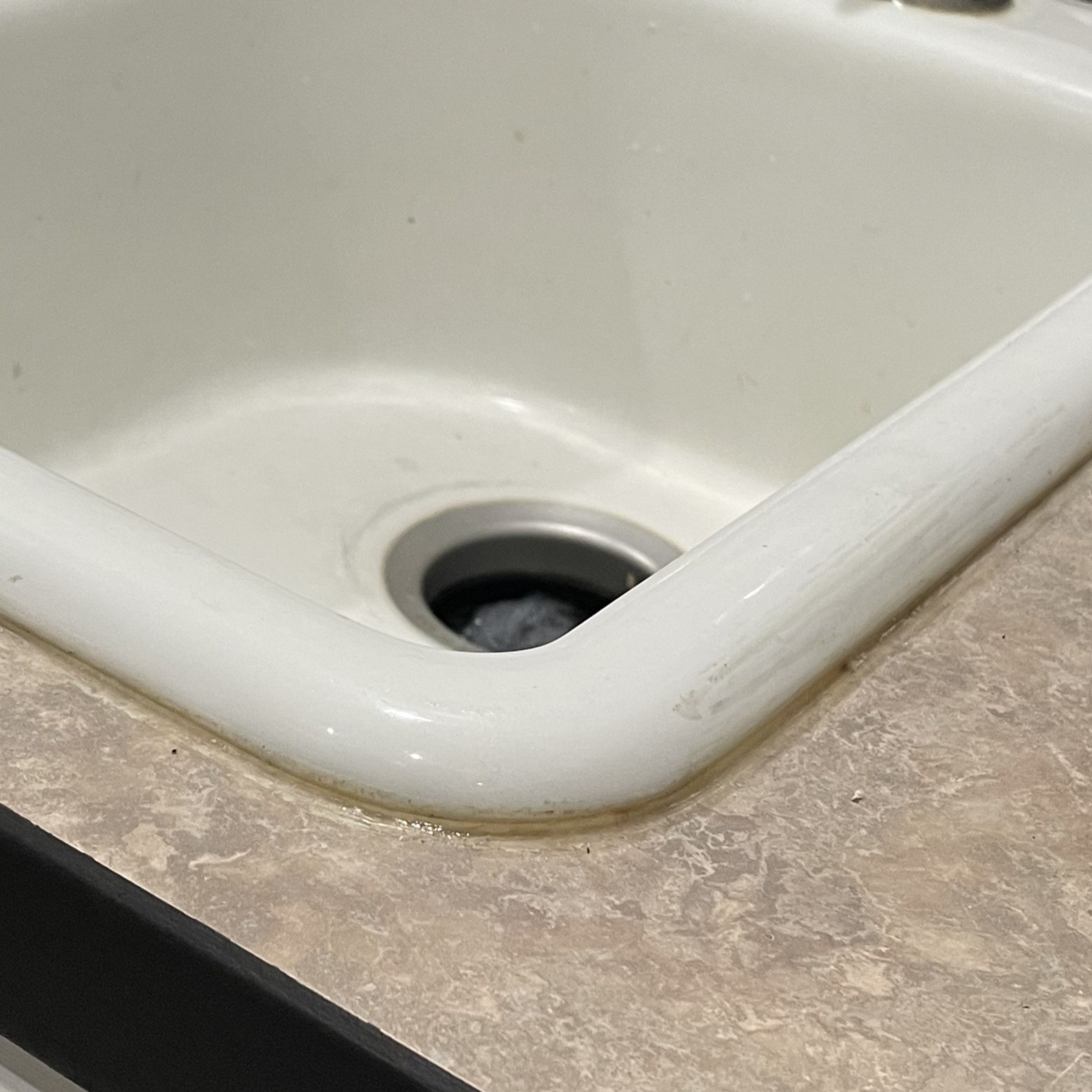 Sink caulking before.